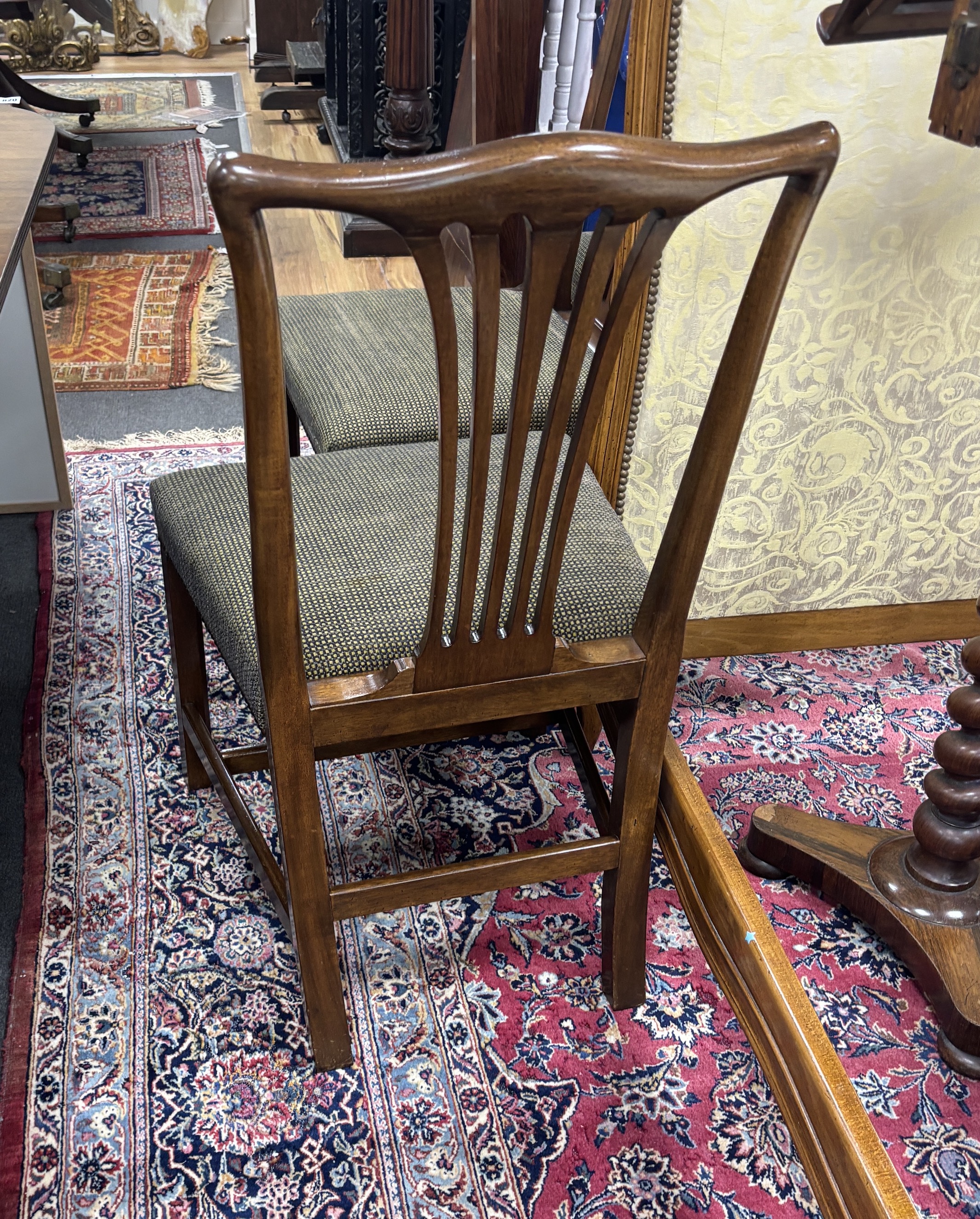 A set of twelve reproduction George III style mahogany dining chairs, ten single, two elbow chairs